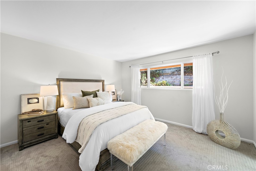3044 Cresta Way Laguna Beach, CA 92651 - Photo 26 of 48 a bedroom with a bed and a night stand