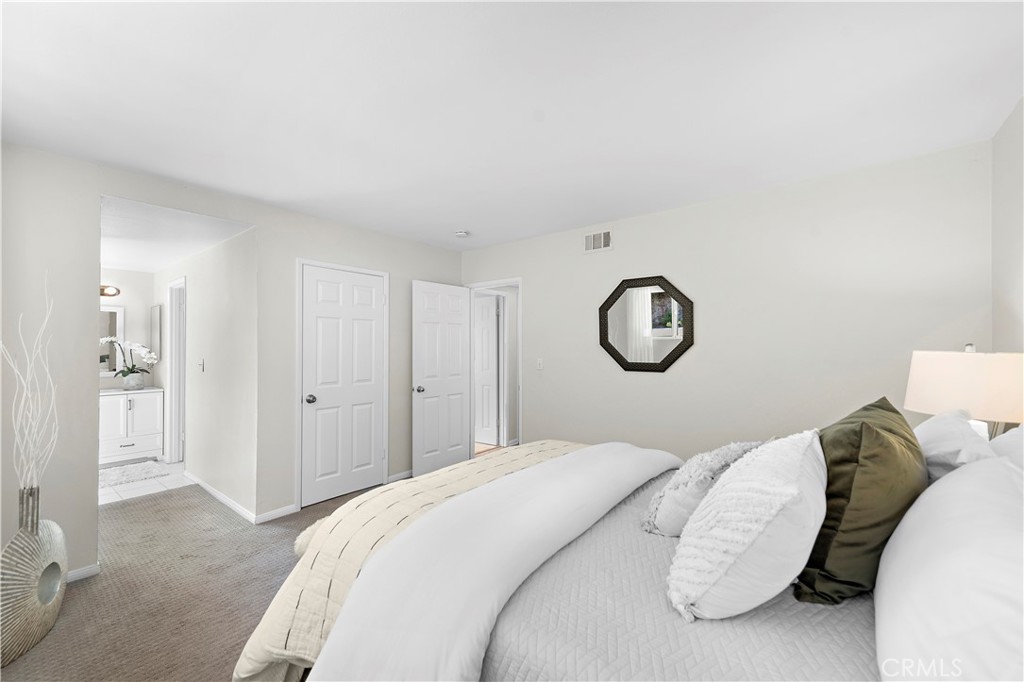 3044 Cresta Way Laguna Beach, CA 92651 - Photo 27 of 48 a bedroom with a bed and closet