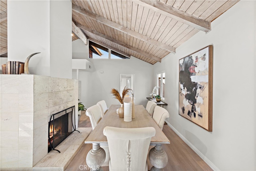 3044 Cresta Way Laguna Beach, CA 92651 - Photo 9 of 48 a dining room with furniture and fireplace