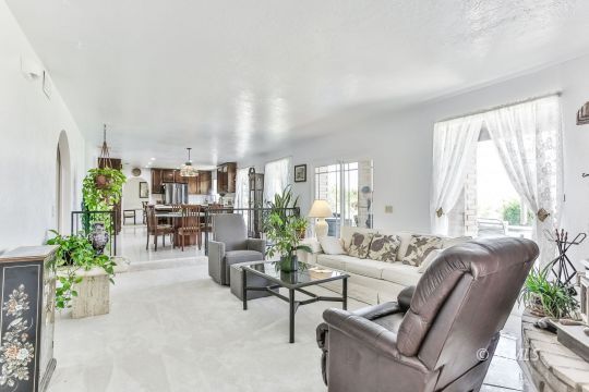 712 East Kendall Avenue Ridgecrest, CA 93555 - Photo 14 of 50 a living room with furniture and a large window