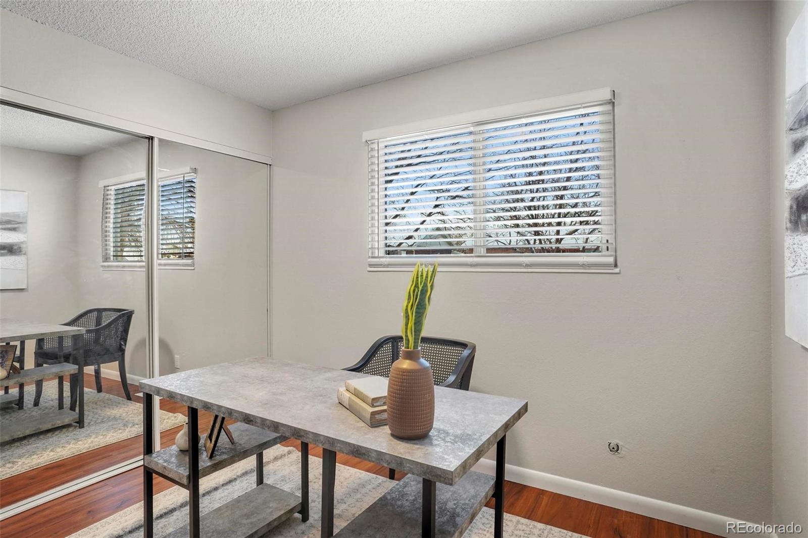 5522 Carson Street Denver, CO 80239 - Photo 17 of 40 a view of a workspace with furniture and window