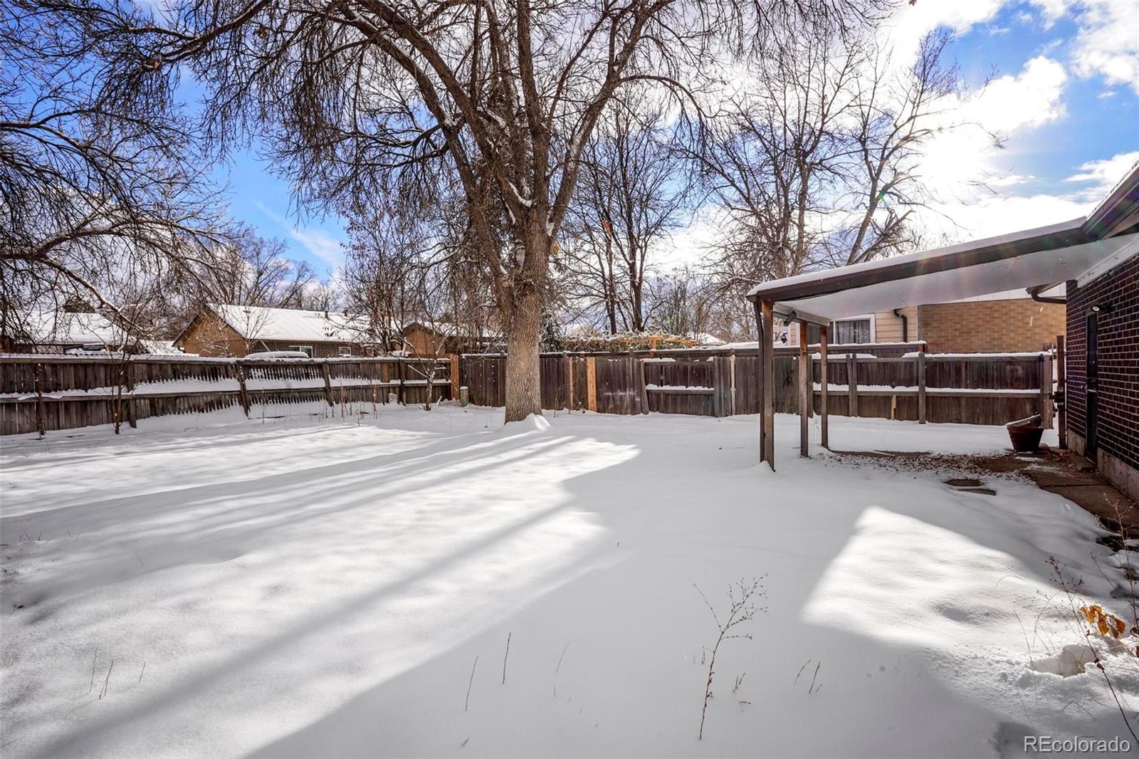 5522 Carson Street Denver, CO 80239 - Photo 34 of 40 a view of a bench in a yard
