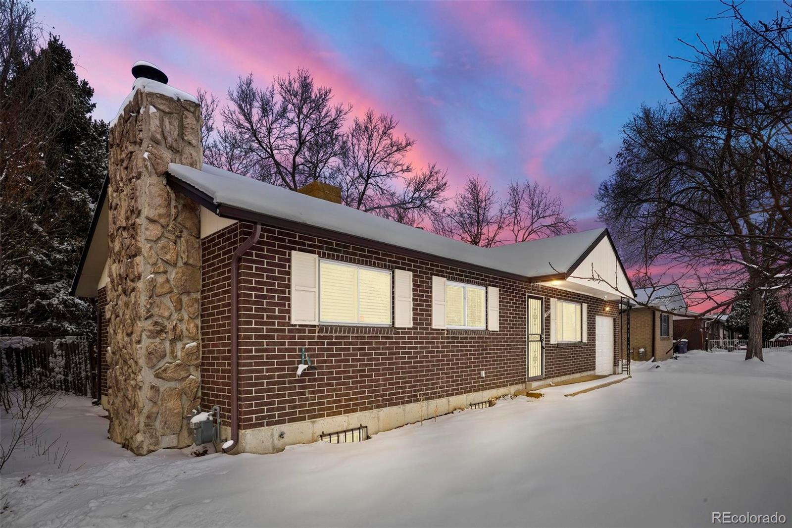 5522 Carson Street Denver, CO 80239 - Photo 4 of 40 a view of a house with a tree