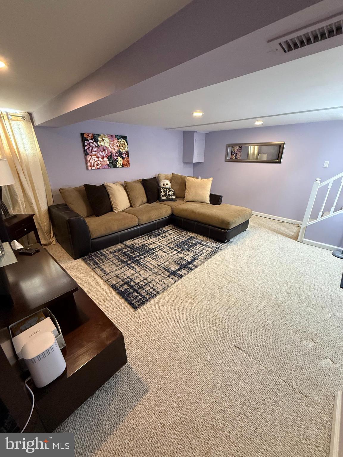 2235 Hawthorne Road Baltimore, MD 21220 - Photo 22 of 35 a living room with furniture and a lamp
