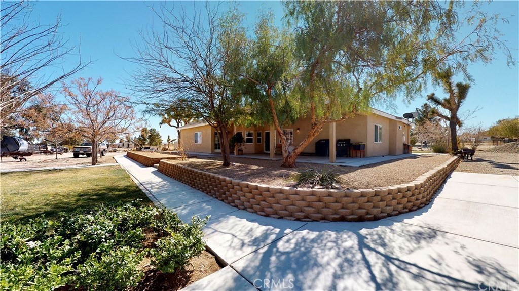 4778 Luna Road Phelan, CA 92371 - Photo 3 of 6 a view of a fountain with large trees
