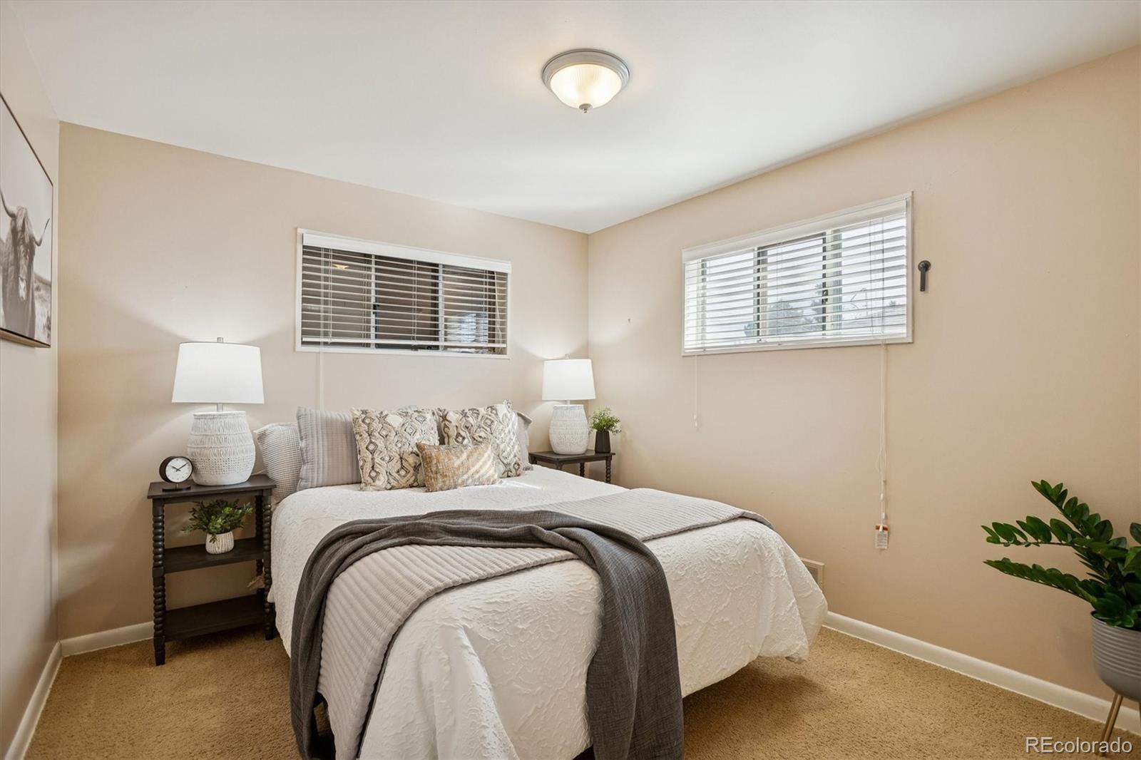7798 Quivas Street Denver, CO 80221 - Photo 11 of 39 a bedroom with bed and a window