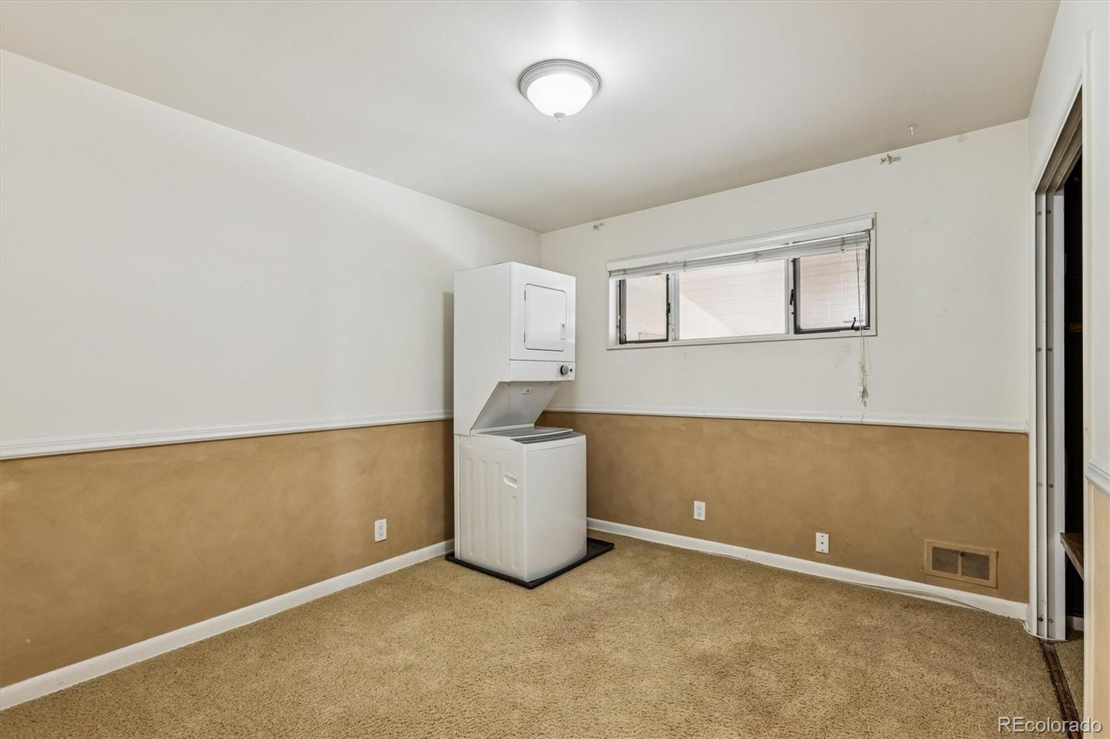 7798 Quivas Street Denver, CO 80221 - Photo 13 of 39 a room with a window