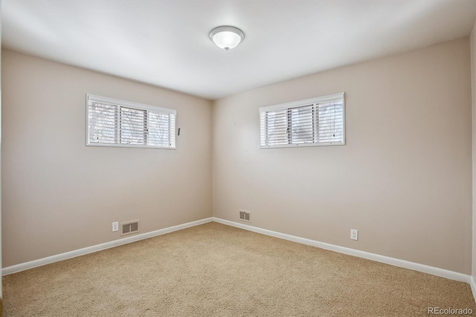7798 Quivas Street Denver, CO 80221 - Photo 17 of 39 an empty room with a window