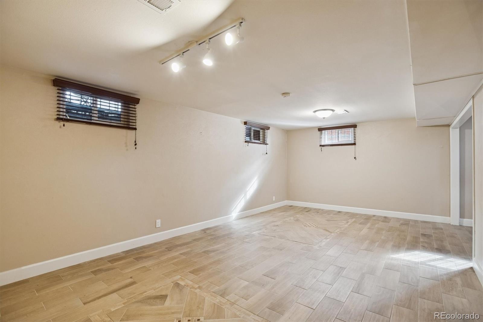 7798 Quivas Street Denver, CO 80221 - Photo 22 of 39 a view of an empty room