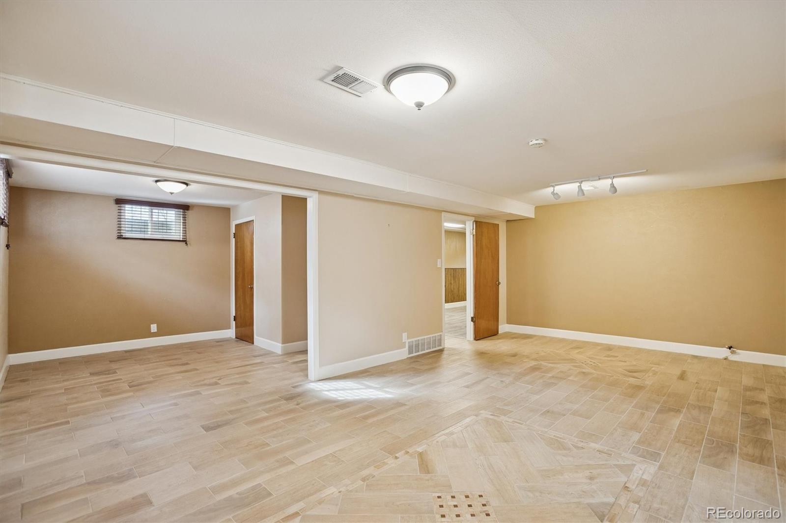7798 Quivas Street Denver, CO 80221 - Photo 23 of 39 a view of an empty room