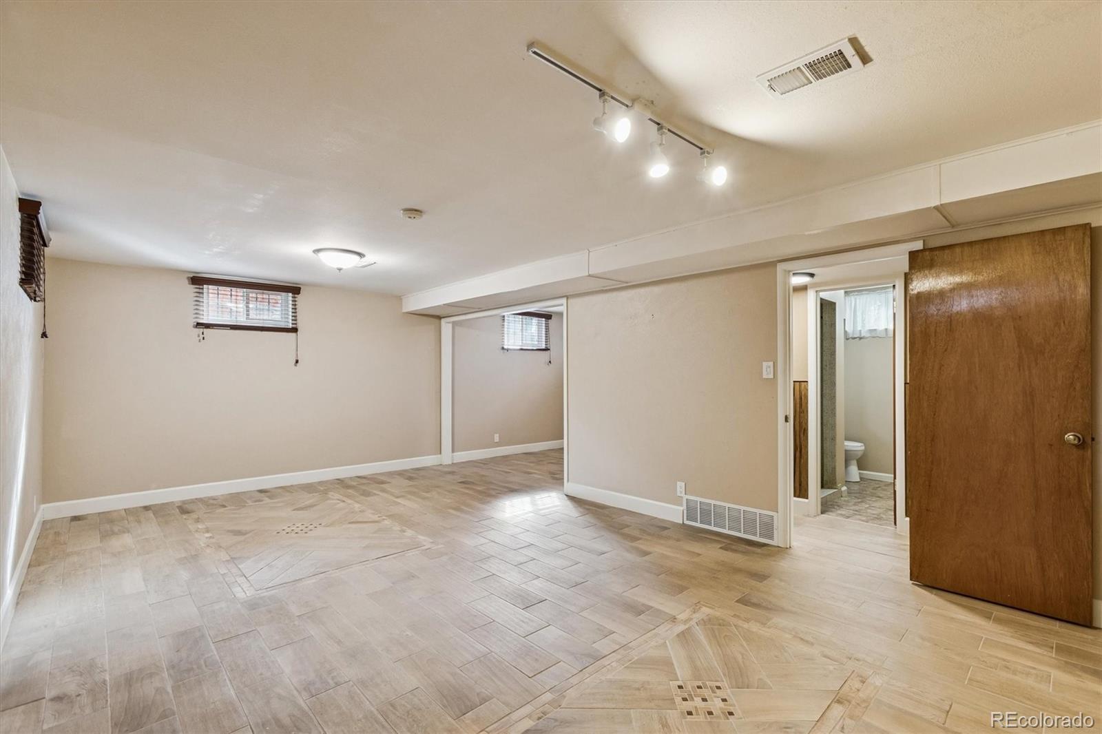 7798 Quivas Street Denver, CO 80221 - Photo 24 of 39 a view of an empty room