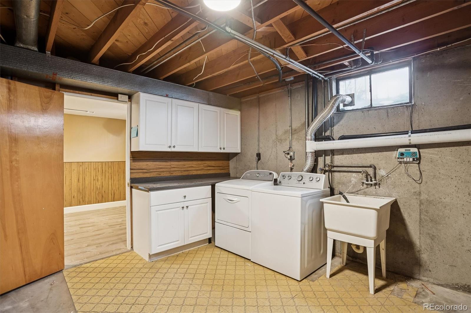 7798 Quivas Street Denver, CO 80221 - Photo 28 of 39 a utility room with dryer and washer