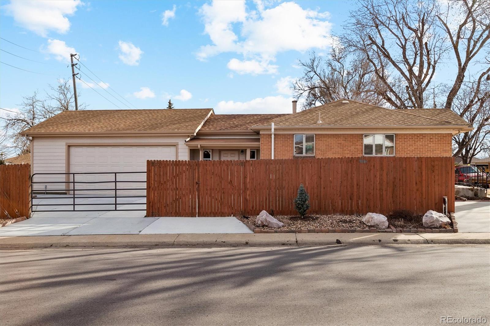 7798 Quivas Street Denver, CO 80221 - Photo 37 of 39 a view of a house with a snow on the road