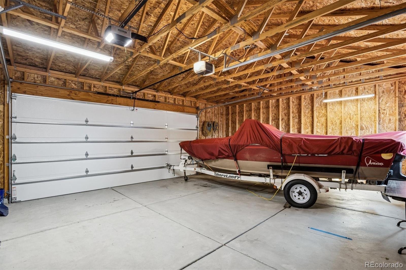 7798 Quivas Street Denver, CO 80221 - Photo 38 of 39 a car parked in a garage