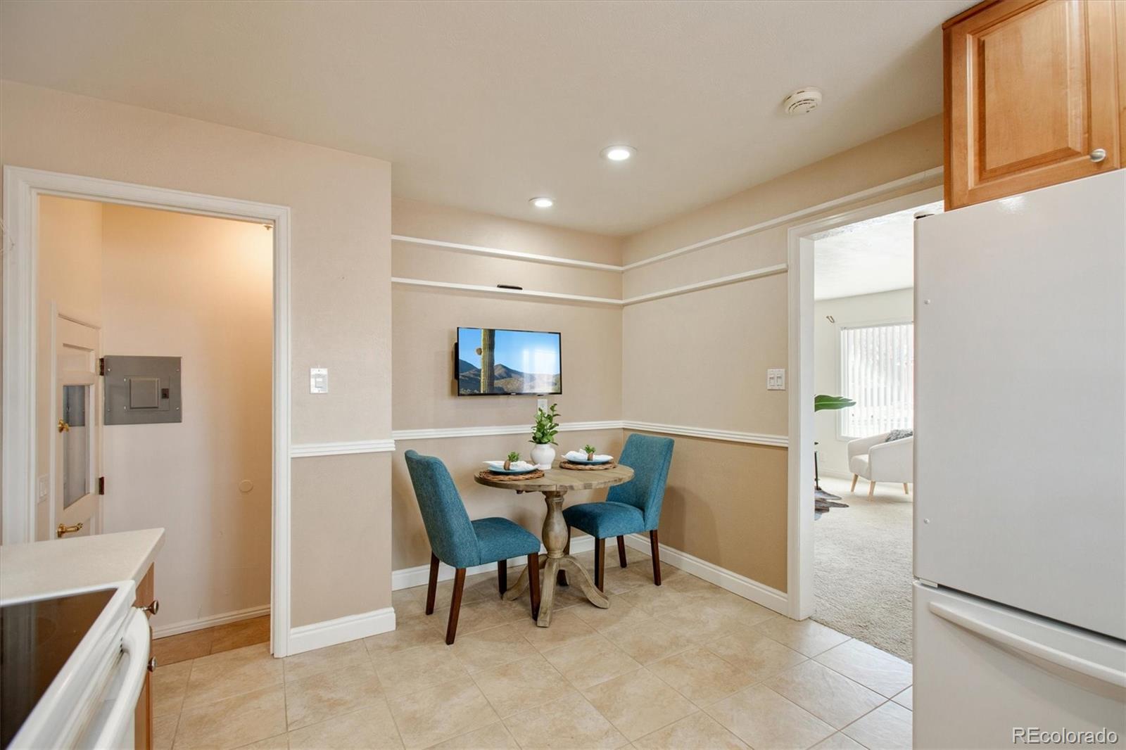 7798 Quivas Street Denver, CO 80221 - Photo 9 of 39 a view of a dining room with furniture