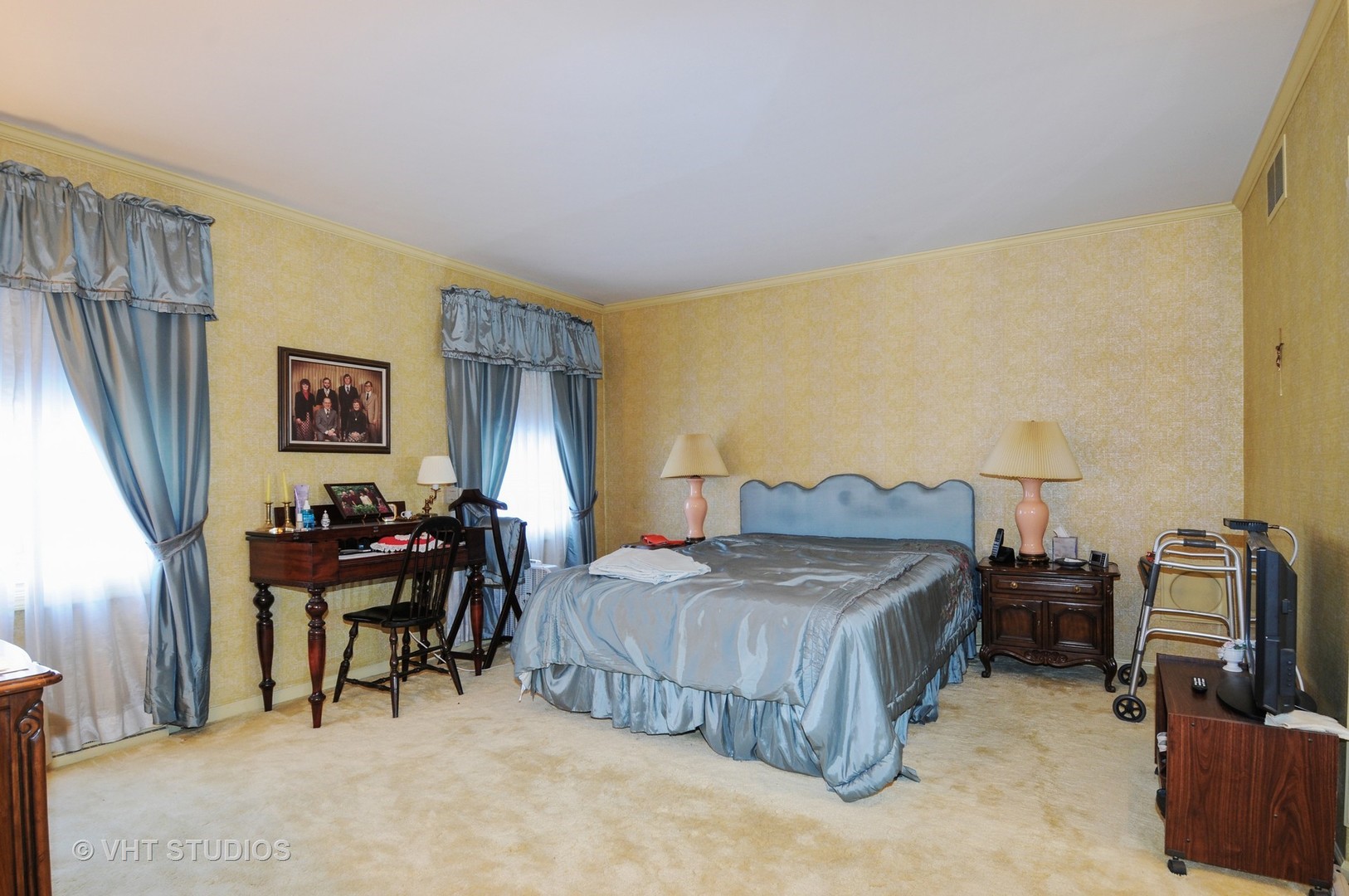 945 Anne Road Naperville, IL 60540 - Photo 6 of 10 a bedroom with a bed and a chandelier