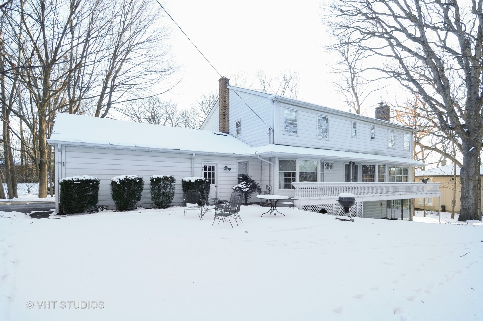 945 Anne Road Naperville, IL 60540 - Photo 9 of 10 a view of a house with a yard covered in snow