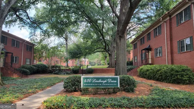 a view of a house with a yard and plants