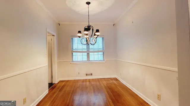 a very nice looking room with a wooden floor and a window