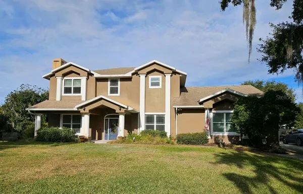 front view of a house with a yard