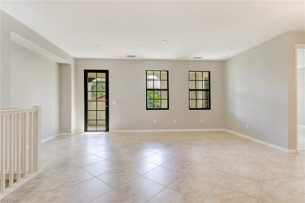 8975 Malibu Street, Unit 1302 Naples, FL 34113 - Photo 12 of 34 an empty room with windows and closet
