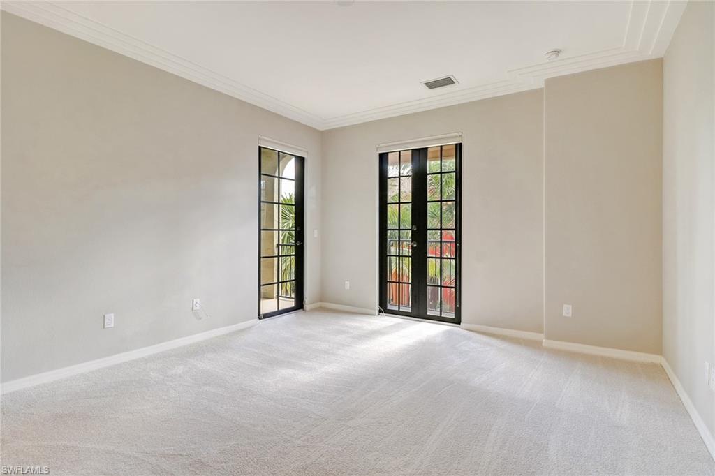 8975 Malibu Street, Unit 1302 Naples, FL 34113 - Photo 13 of 34 an empty room with windows