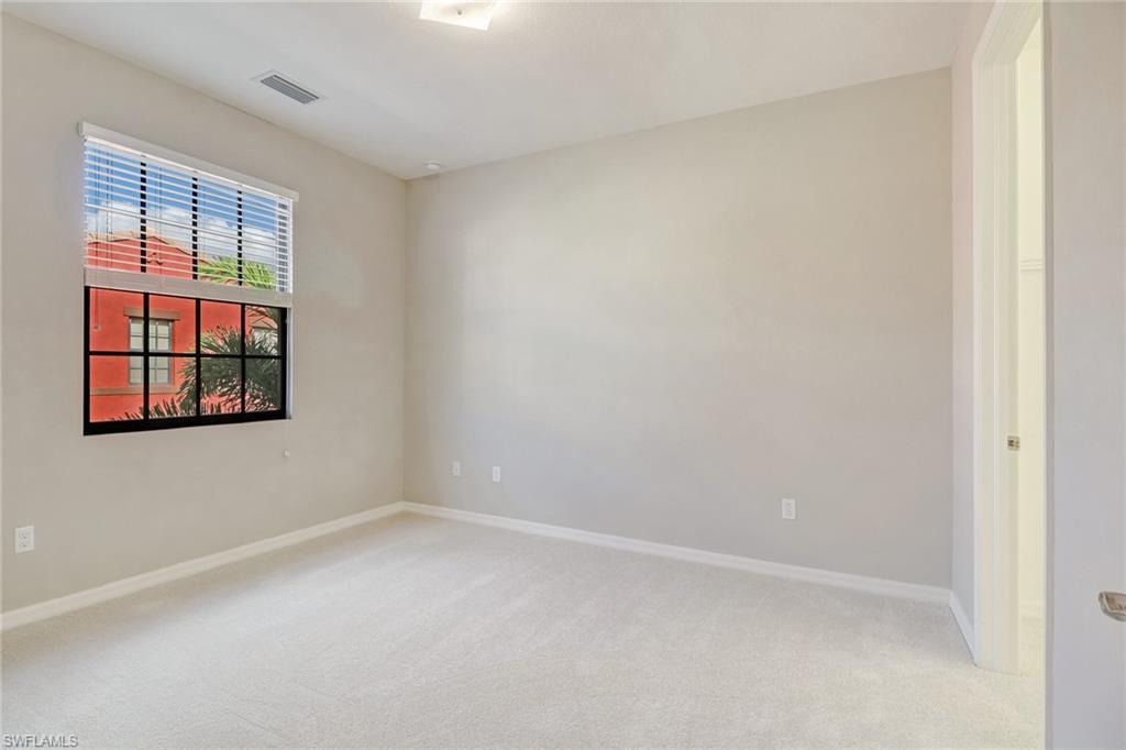 8975 Malibu Street, Unit 1302 Naples, FL 34113 - Photo 17 of 34 an empty room with windows