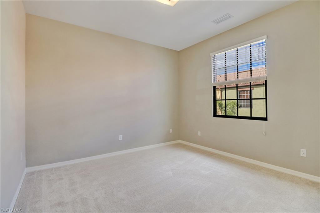 8975 Malibu Street, Unit 1302 Naples, FL 34113 - Photo 20 of 34 an empty room with windows