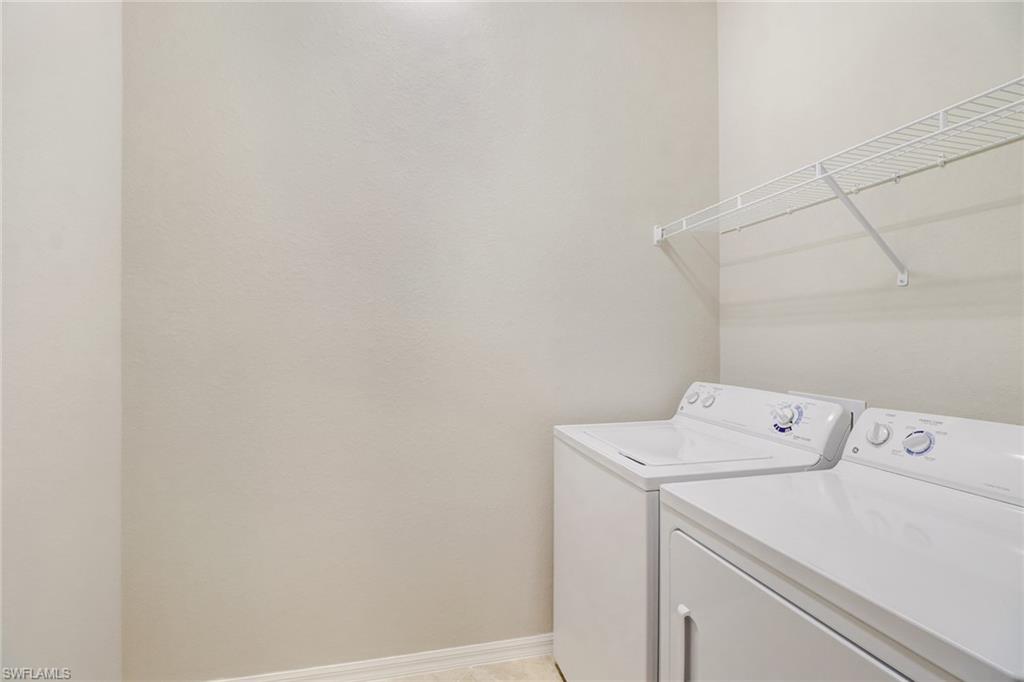 8975 Malibu Street, Unit 1302 Naples, FL 34113 - Photo 21 of 34 a utility room with dryer and washer