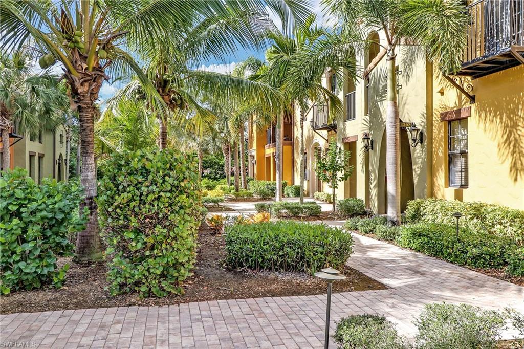 8975 Malibu Street, Unit 1302 Naples, FL 34113 - Photo 26 of 34 a view of a pathway with a house