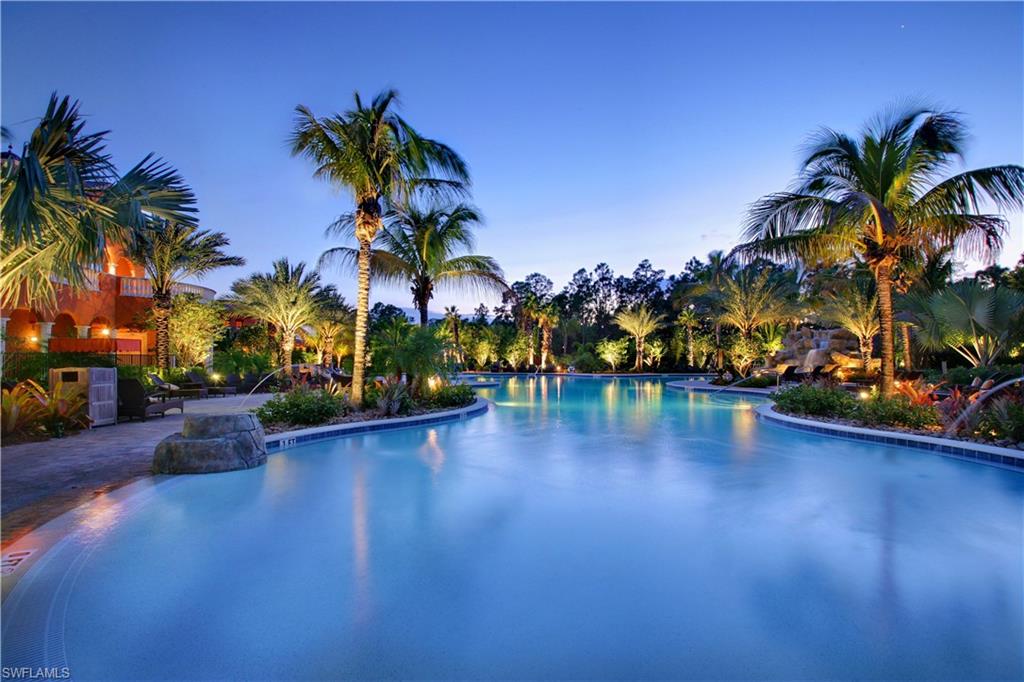 8975 Malibu Street, Unit 1302 Naples, FL 34113 - Photo 27 of 34 a view of a swimming pool with a table and chairs