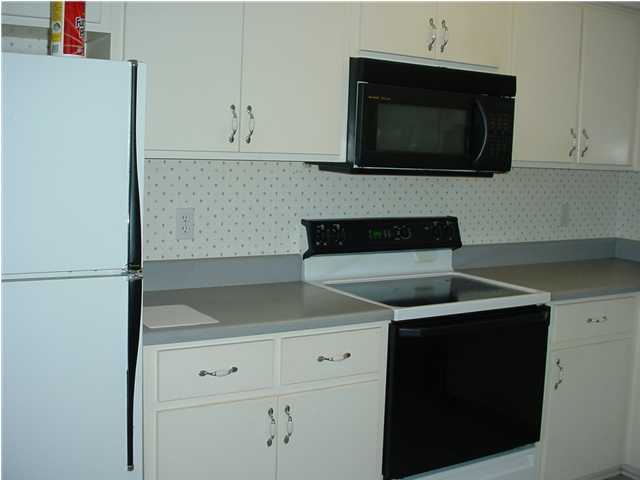 1016 Pinetree Road Mary Esther, FL 32569 - Photo 5 of 14 a kitchen with a sink and cabinets