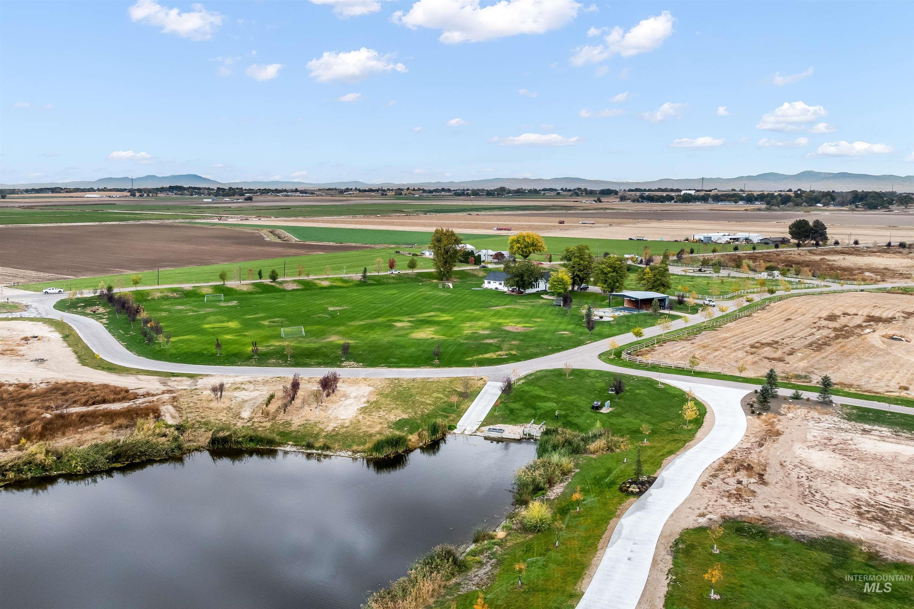 Tbd Tbd Lake Caldwell, ID 83607 - Photo 11 of 18 Aerial view of property and surrounding area featuring rural landscape and a water and mountain view