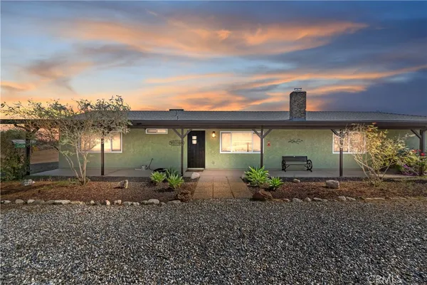 a view of house with outdoor space and porch