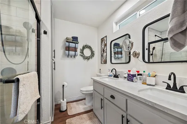 a bathroom with a sink toilet and shower