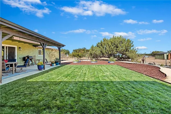 a view of a yard in front of a house