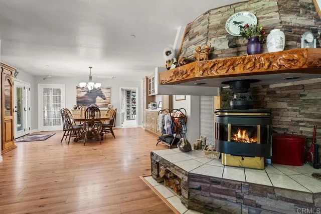 a view of a dining room with furniture and chandelier
