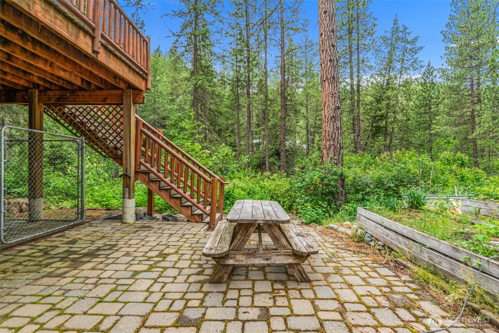 3888 Camas Creek Road Peshastin, WA 98847 - Photo 39 of 40 a view of a yard with plants and a lawn chairs