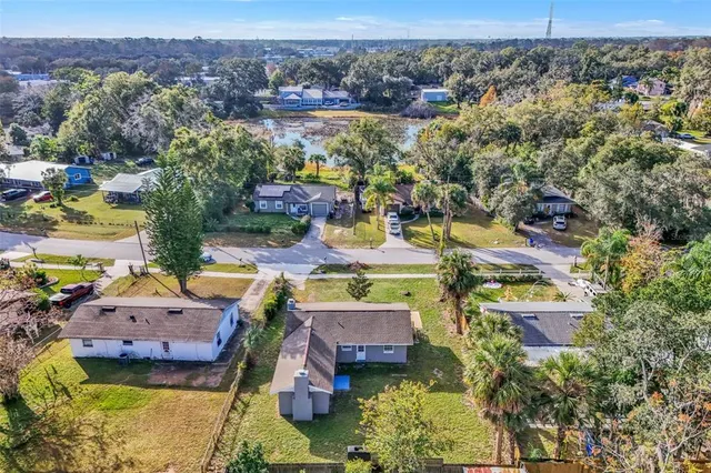 an aerial view of residential houses with outdoor space