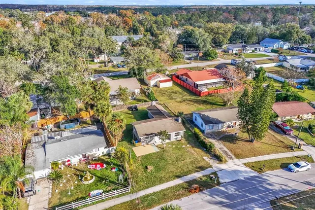 an aerial view of residential houses with outdoor space