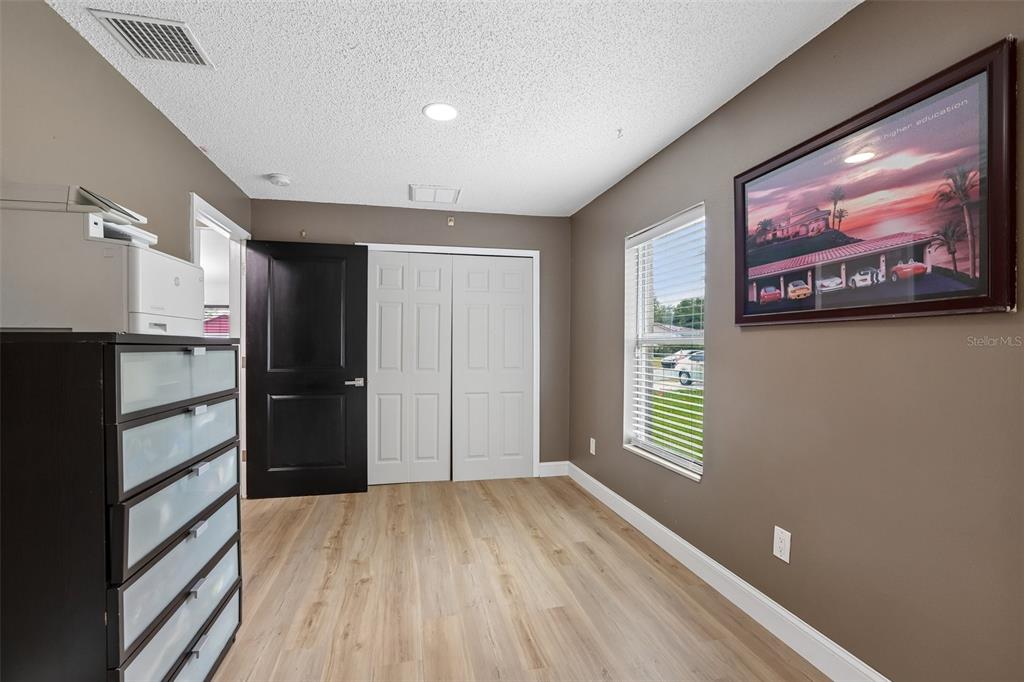 1525 Kestrel Way Brandon, FL 33511 - Photo 21 of 48 a view of a kitchen with wooden floor electronic appliances and a window
