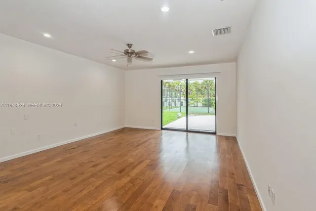 a bathroom with a granite countertop bathtub sink vanity and shower