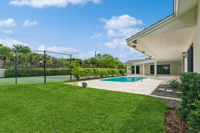 a garden with palm trees