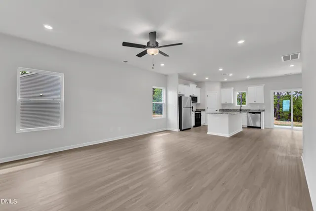 a view of a kitchen with a sink and a stove top oven