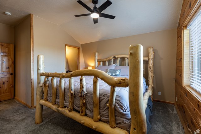 1505 West Elk Ridge Drive Alton, UT 84710 - Photo 20 of 53 Bedroom with dark colored carpet, vaulted ceiling, and a ceiling fan