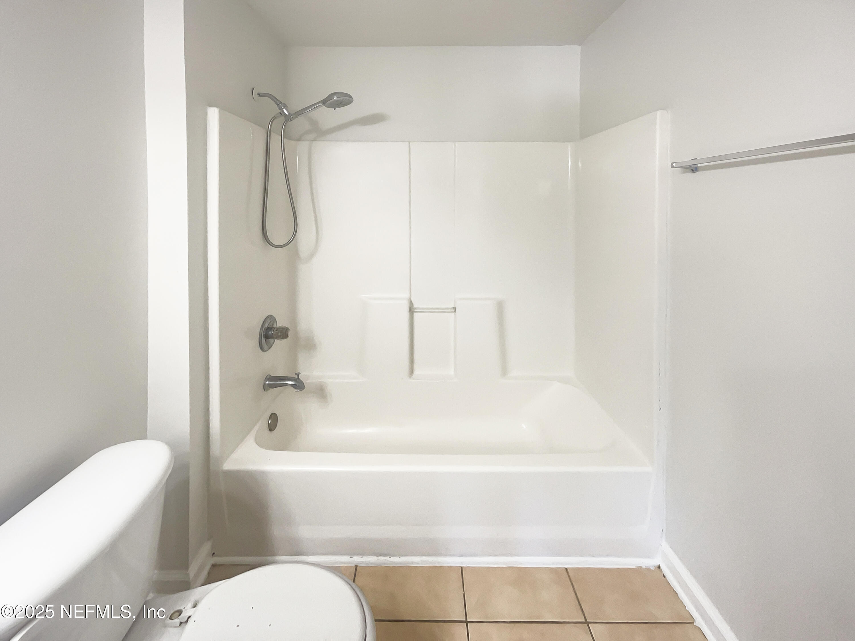 7920 Merrill Road, Unit 1115 Jacksonville, FL 32277 - Photo 13 of 19 a bathroom with a sink a toilet and shower