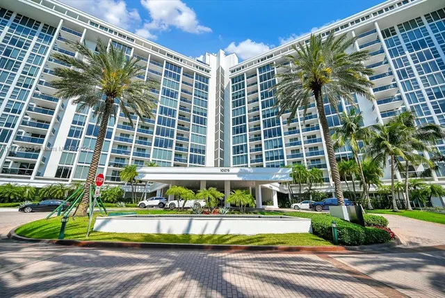 a spacious bedroom with a large bed and a flat screen tv