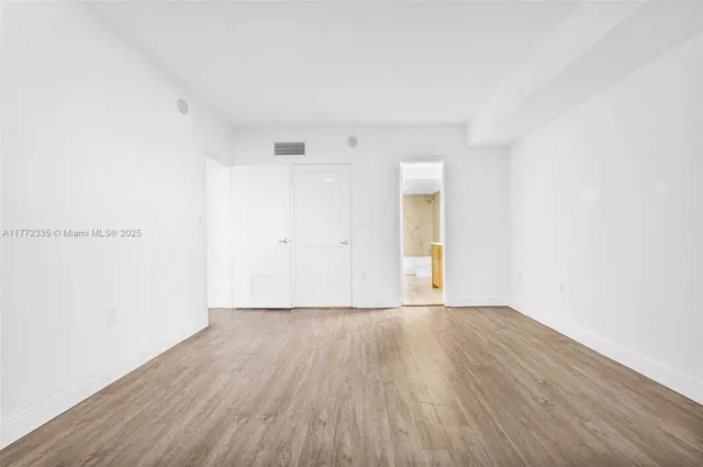 a kitchen with stainless steel appliances granite countertop a sink and a stove