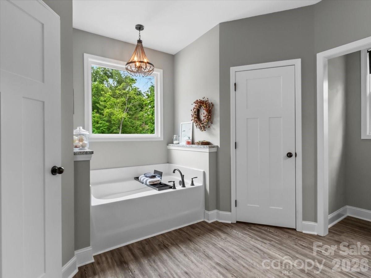 36 Cherry Ridge Lane Weaverville, NC 28787 - Photo 20 of 37 a bathroom with a bathtub and a window