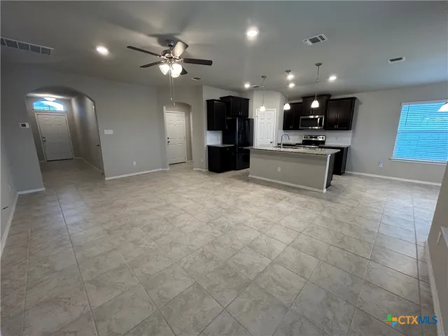 a large room with a large mirror and furniture